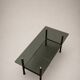 Table basse vintage verre fumé, métal noir et laiton — années 70