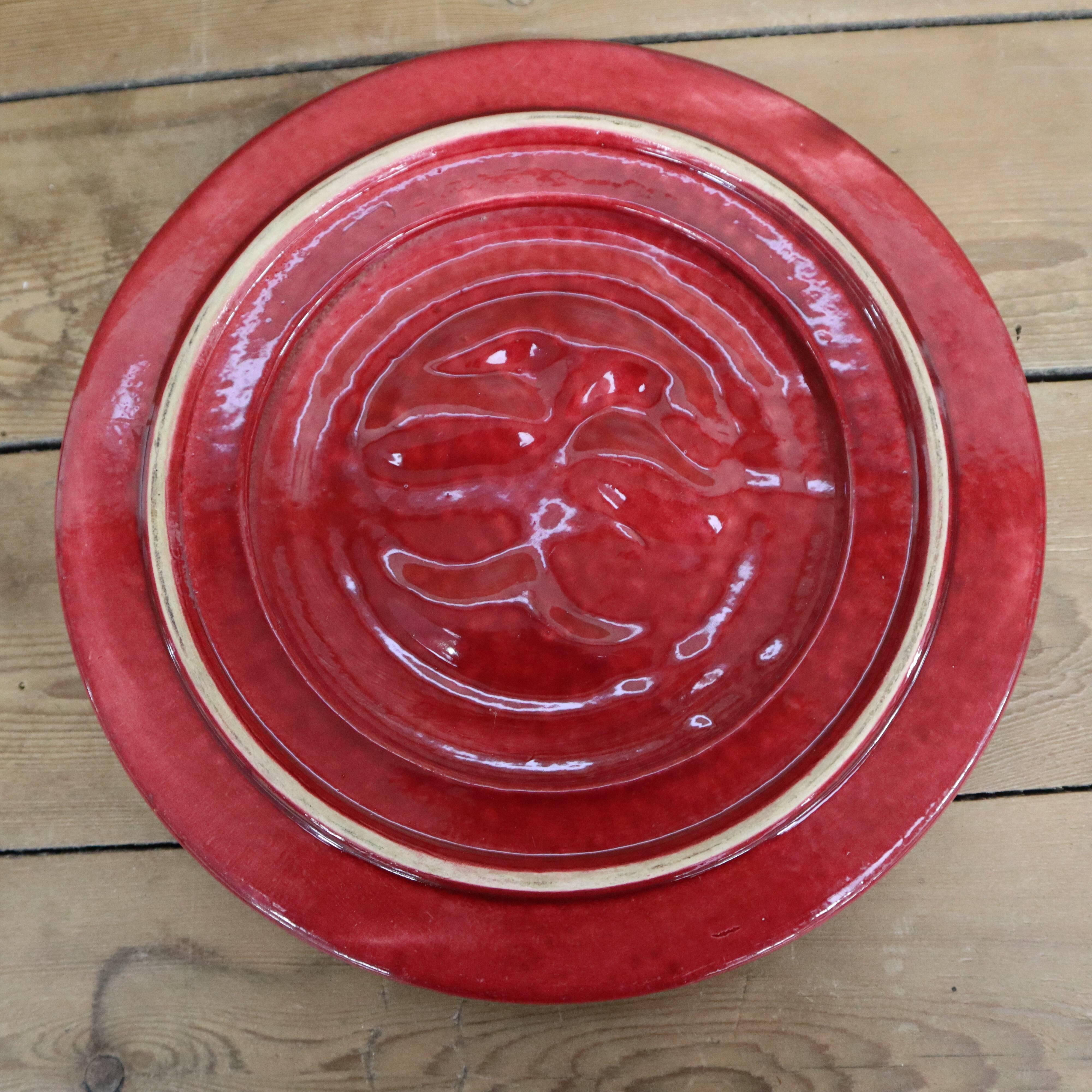 Vintage burgundy duck trivet with gold edging