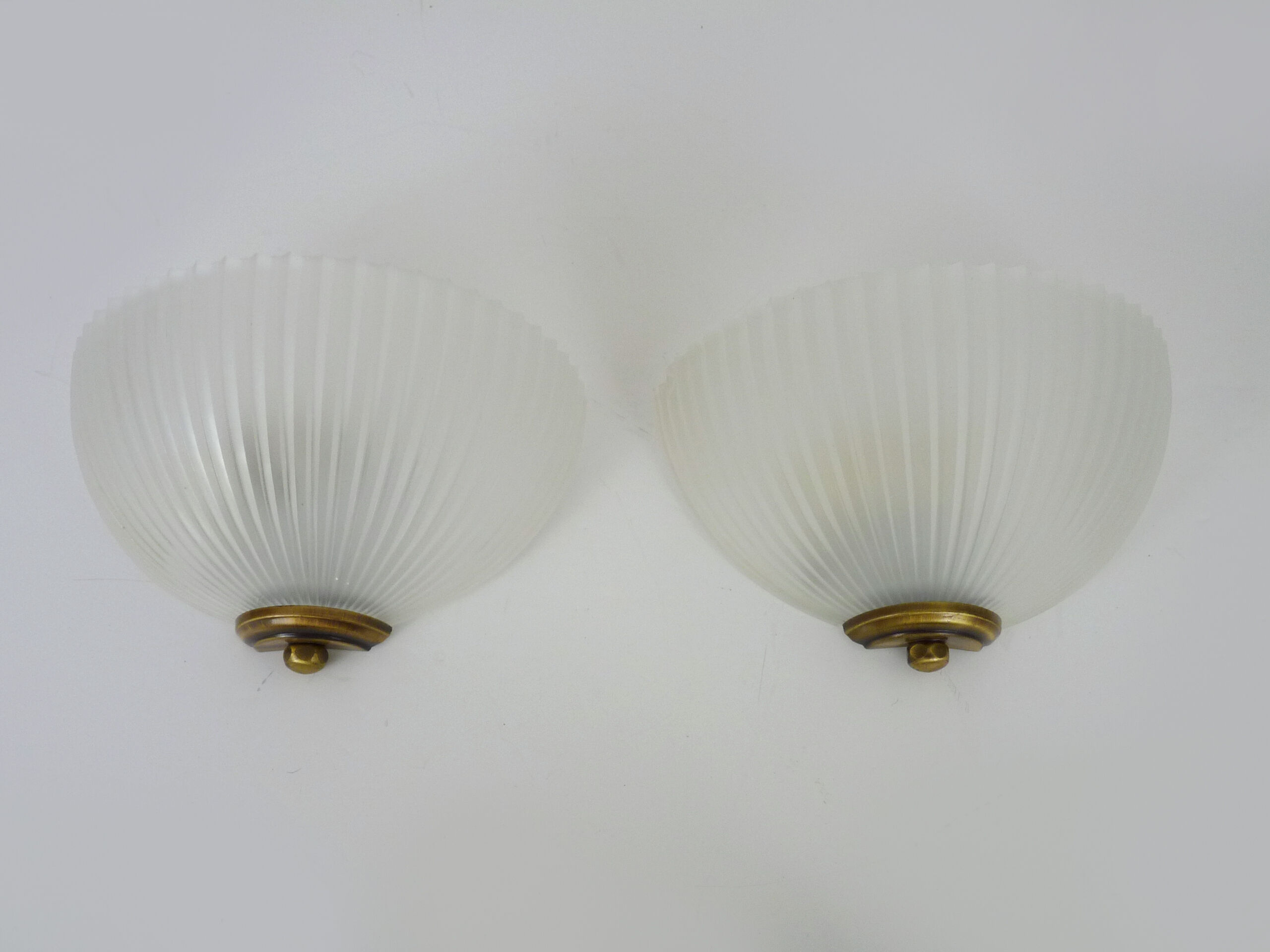 Pair of Mathias wall lamps in gilded metal and white shell-style glass