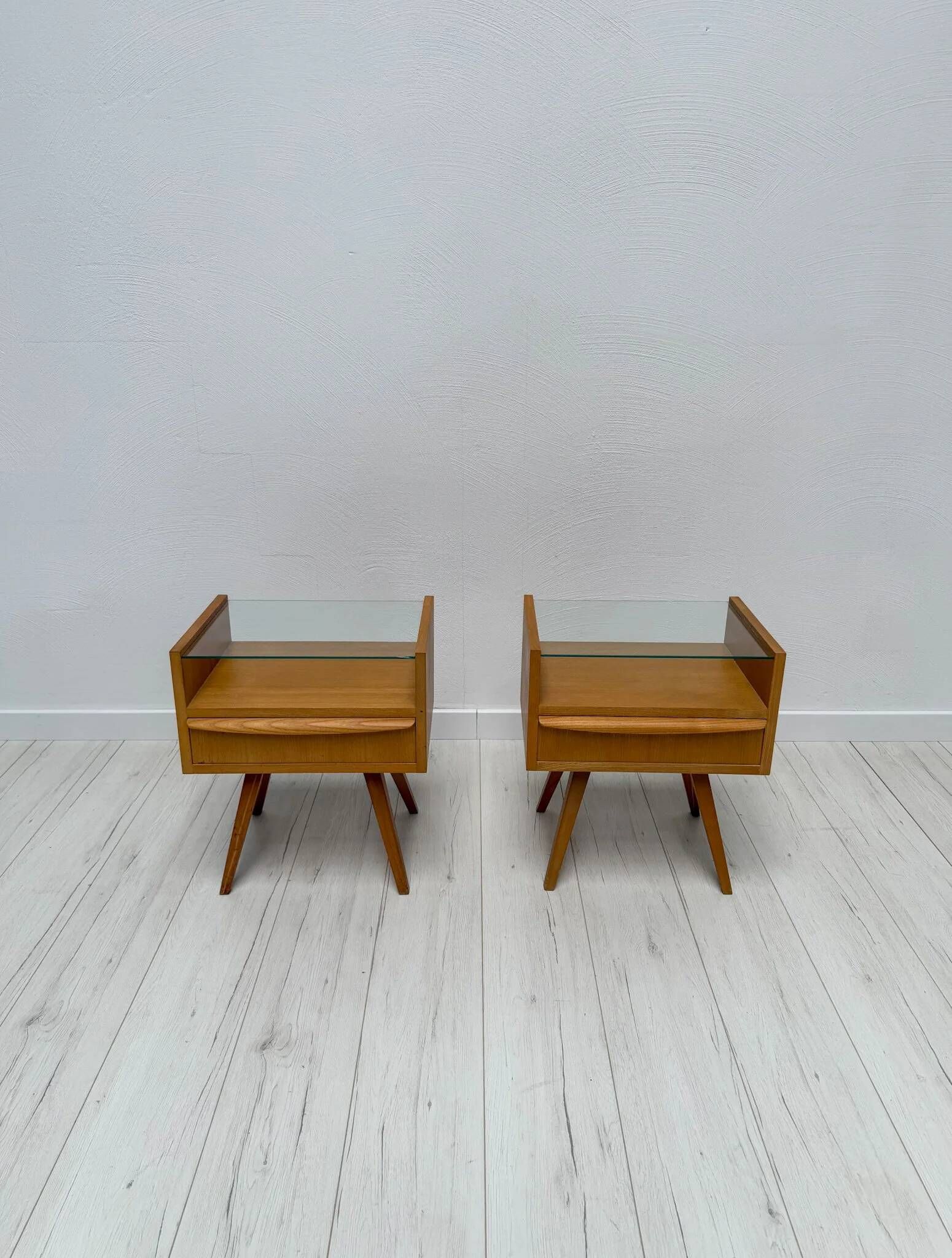 1960s vintage pair of mid-century walnut nightstands with glass shelves