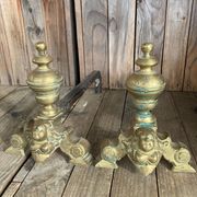 Pair of andirons and grates in cast iron and bronze with gilded grotesques, 17th century