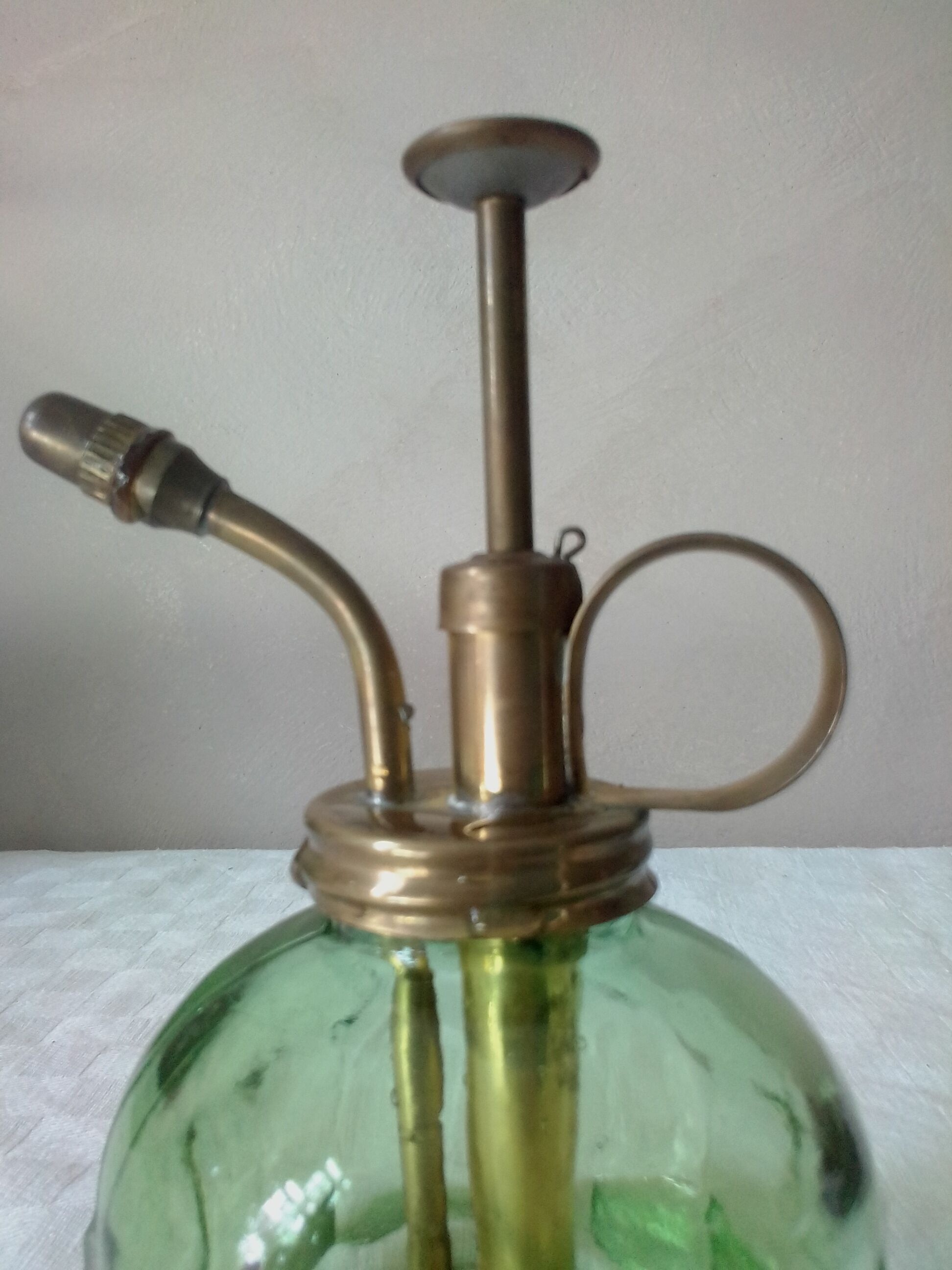 Spray for plants in brass and glass
