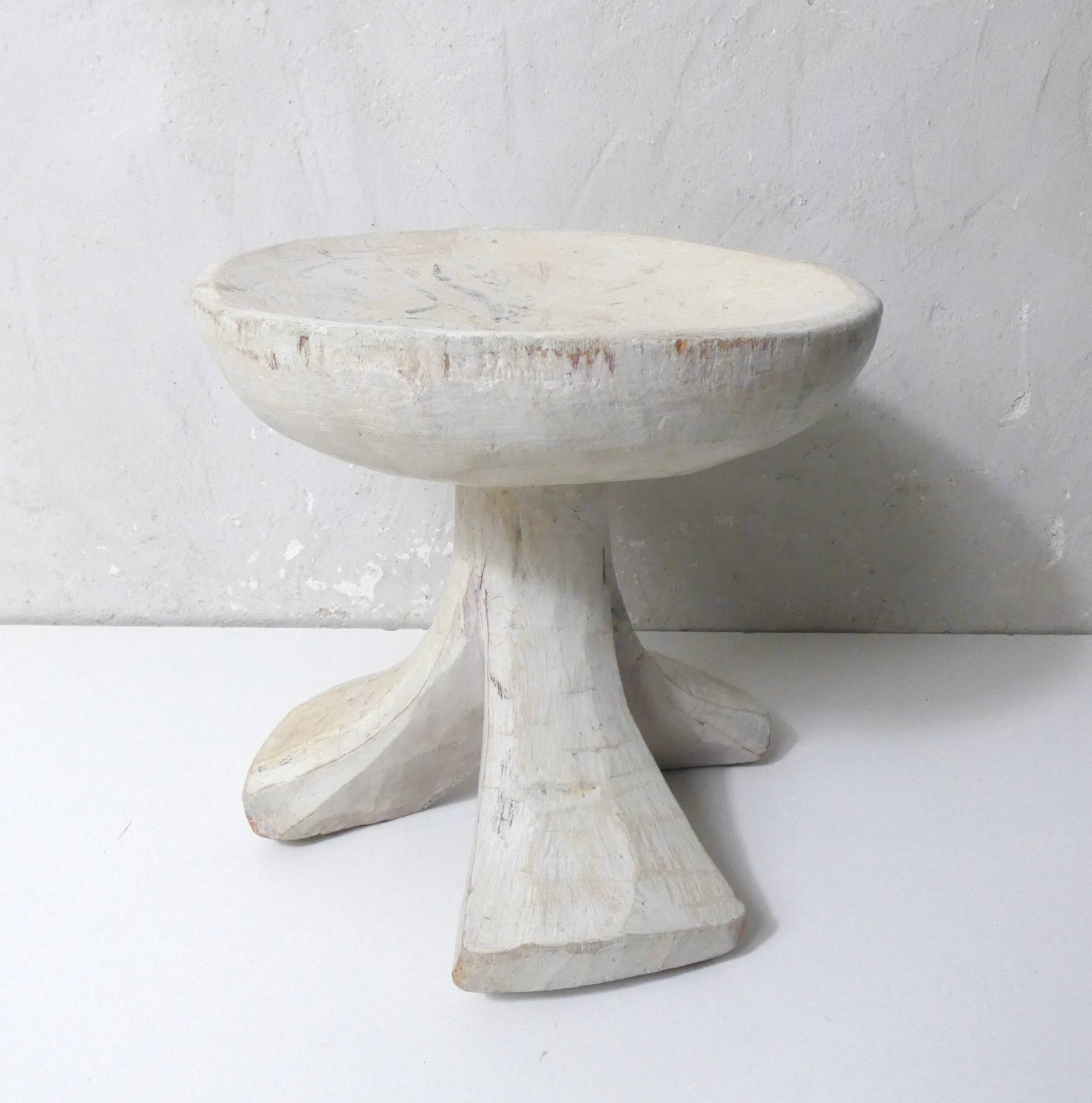 antique small tripod bench/stool in solid carved brutalist wood