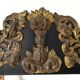 Pediment in blackened wood and 19th century embossed gilded metal foil