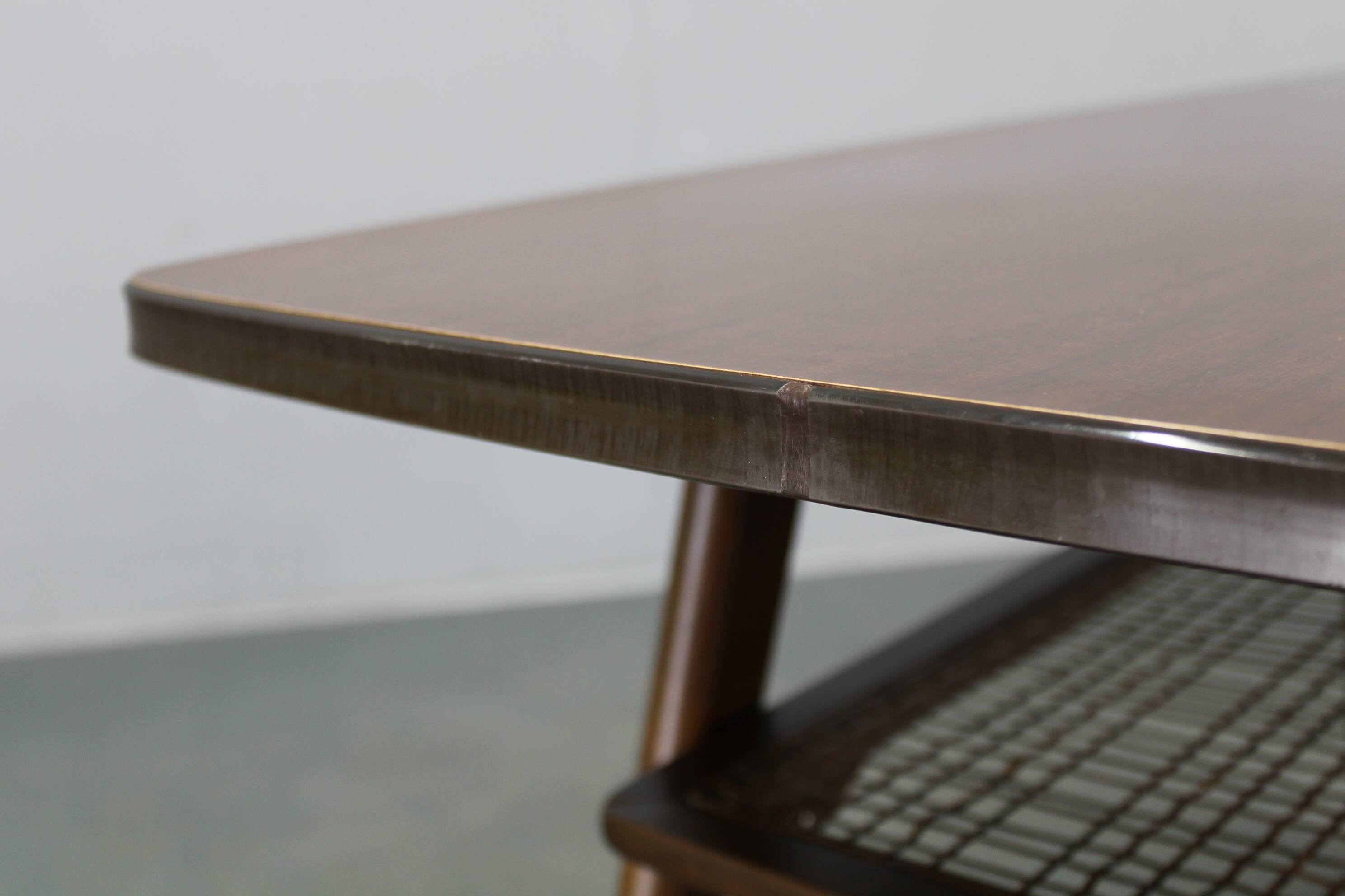Mid-century German coffee table with rattan shelf and brass legs