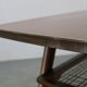 Mid-century German coffee table with rattan shelf and brass legs