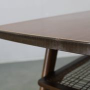Mid-century German coffee table with rattan shelf and brass legs