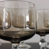 9 white wine glasses on vintage Luminarc smoked black stem