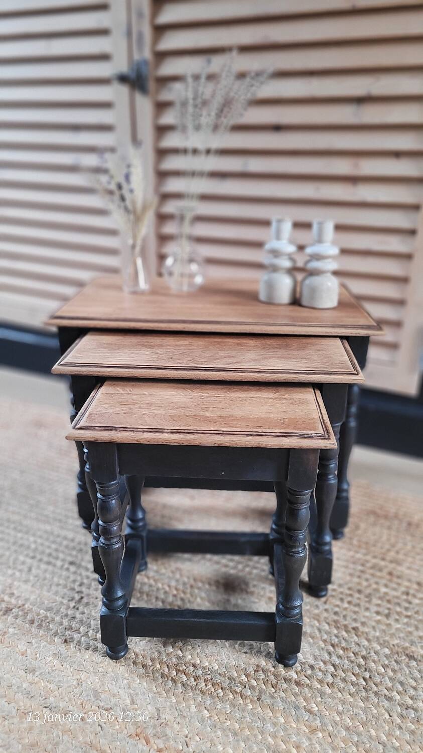 Nest tables in wood and black.