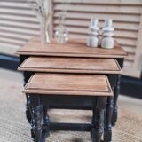 Nest tables in wood and black.