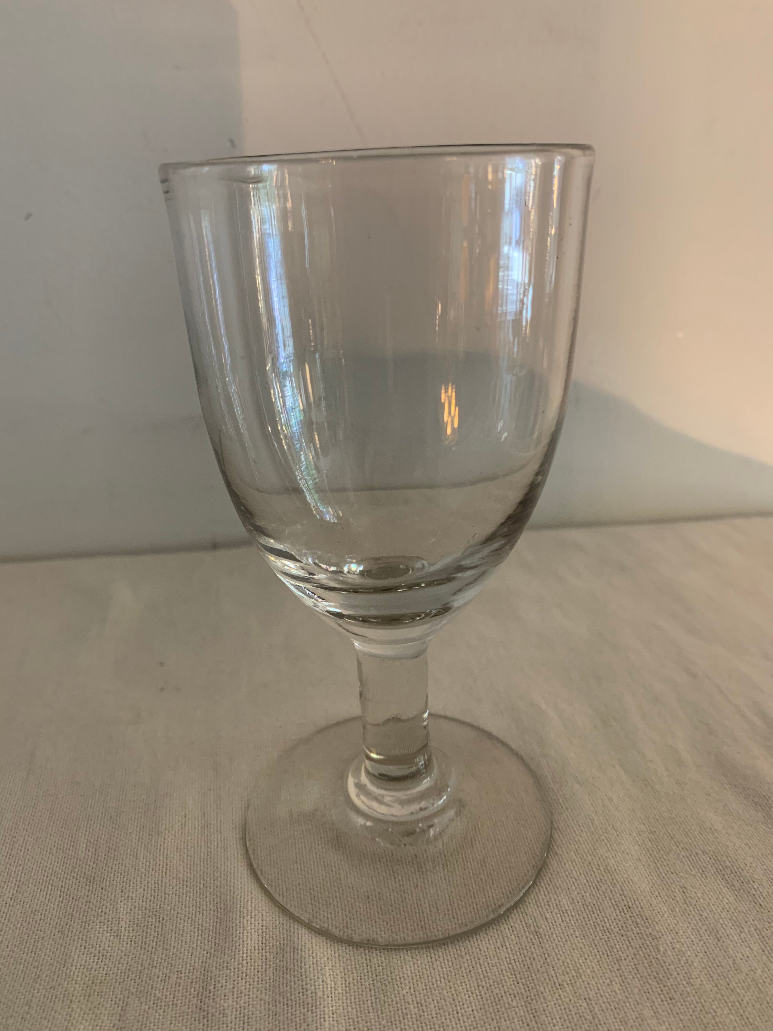 8 old blown and different foot wine glasses