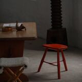 Pair of patinated wooden stools painted red with flared legs, 1950s-1960s.