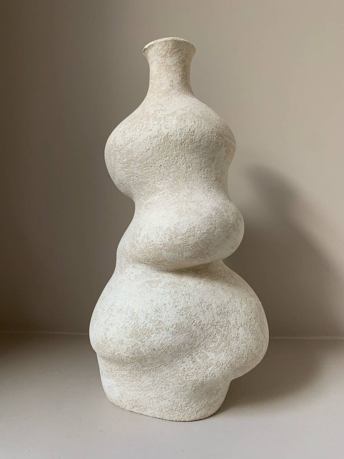 White stoneware vase in an organic shape