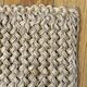 Handmade carpet in natural fiber of knitted palm leaf