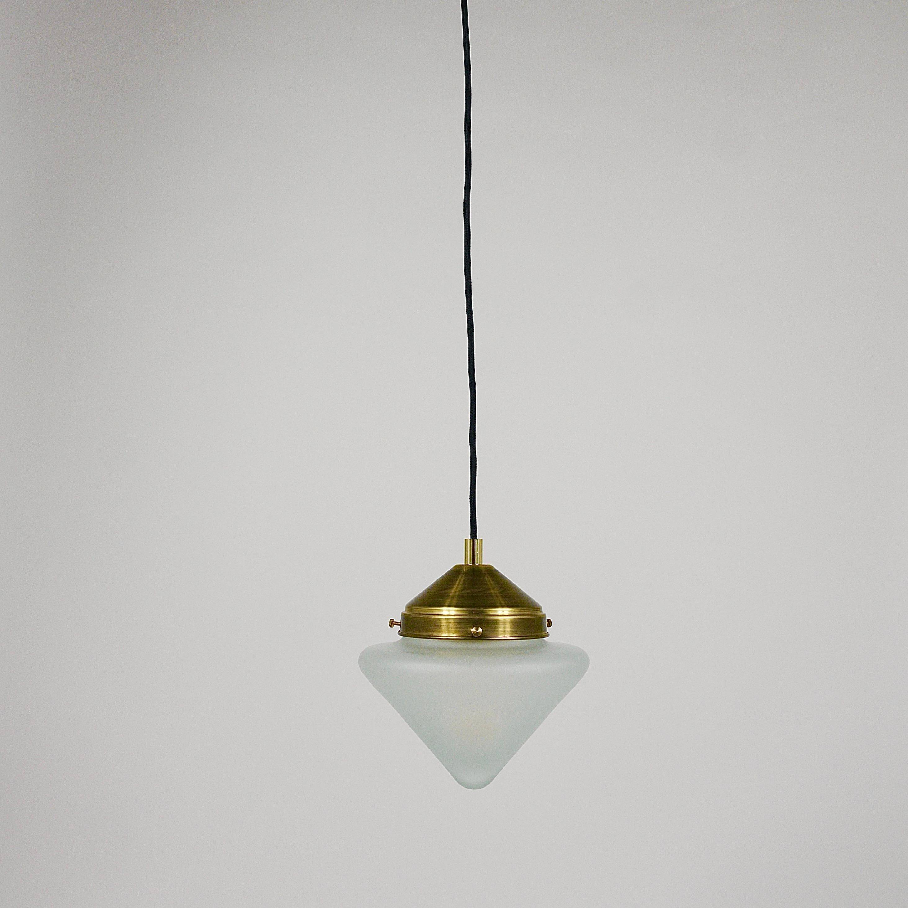 Up to 7 Art Deco brass pendant lights with conical glass shades, Vienna 1930s.
