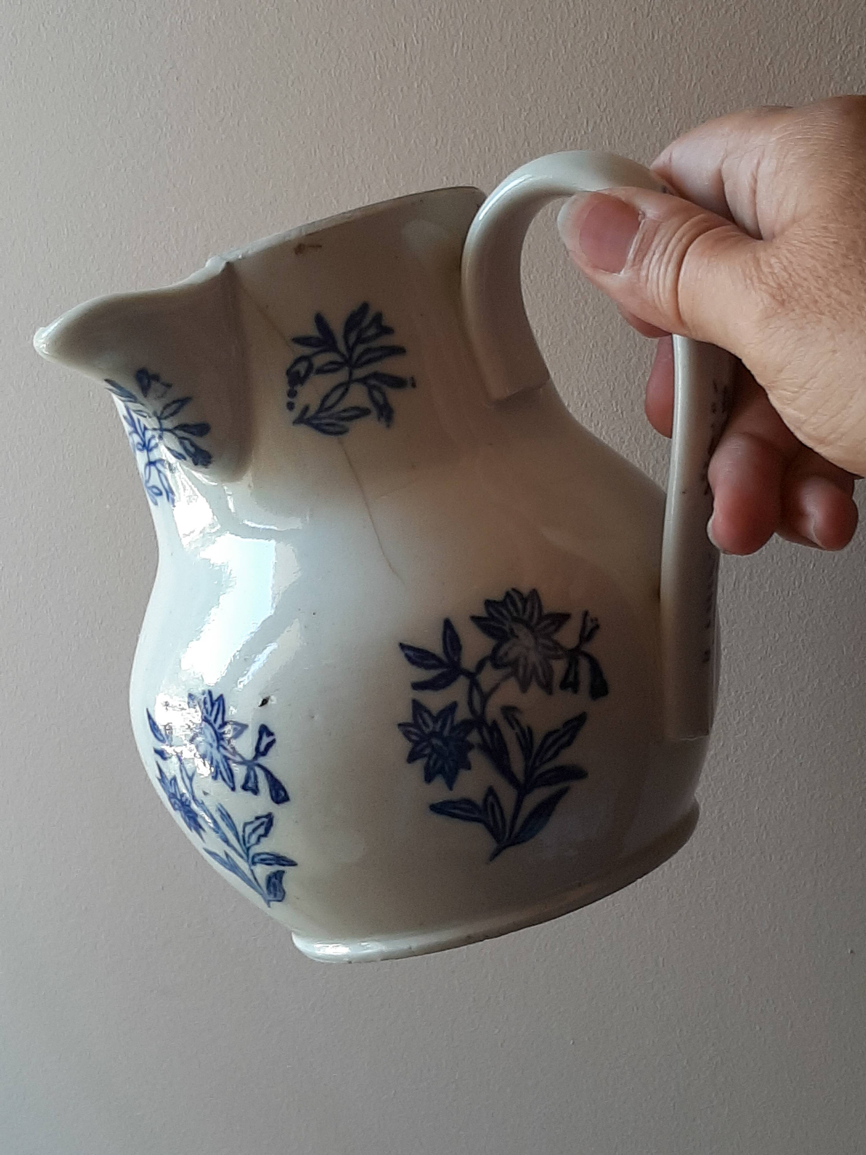 Large antique cruet in Saint Uze earthenware with blue flowers.