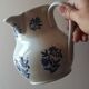 Large antique cruet in Saint Uze earthenware with blue flowers.
