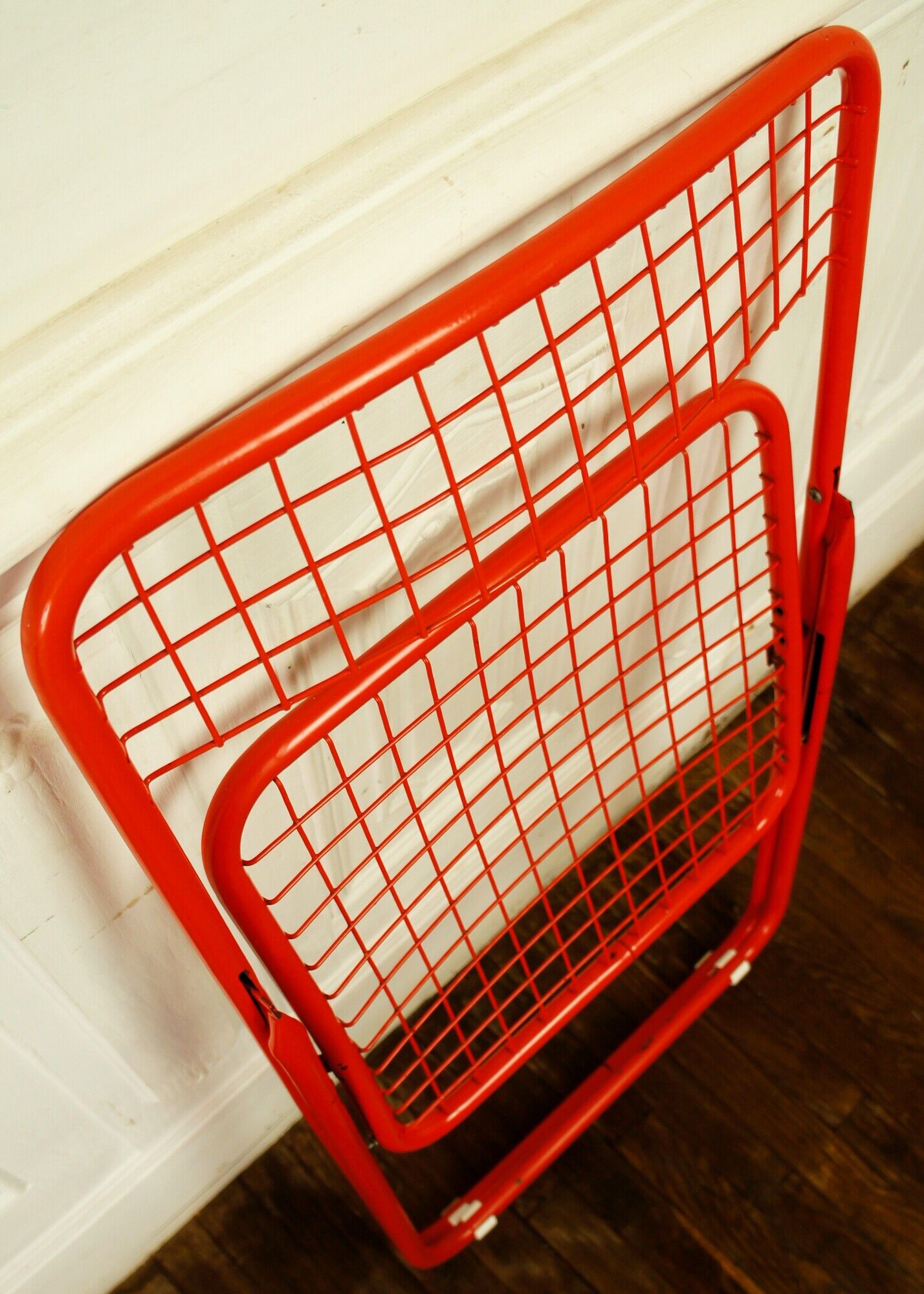 Red "grid" metal folding chair 1980