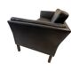 Black leather three-seater sofa