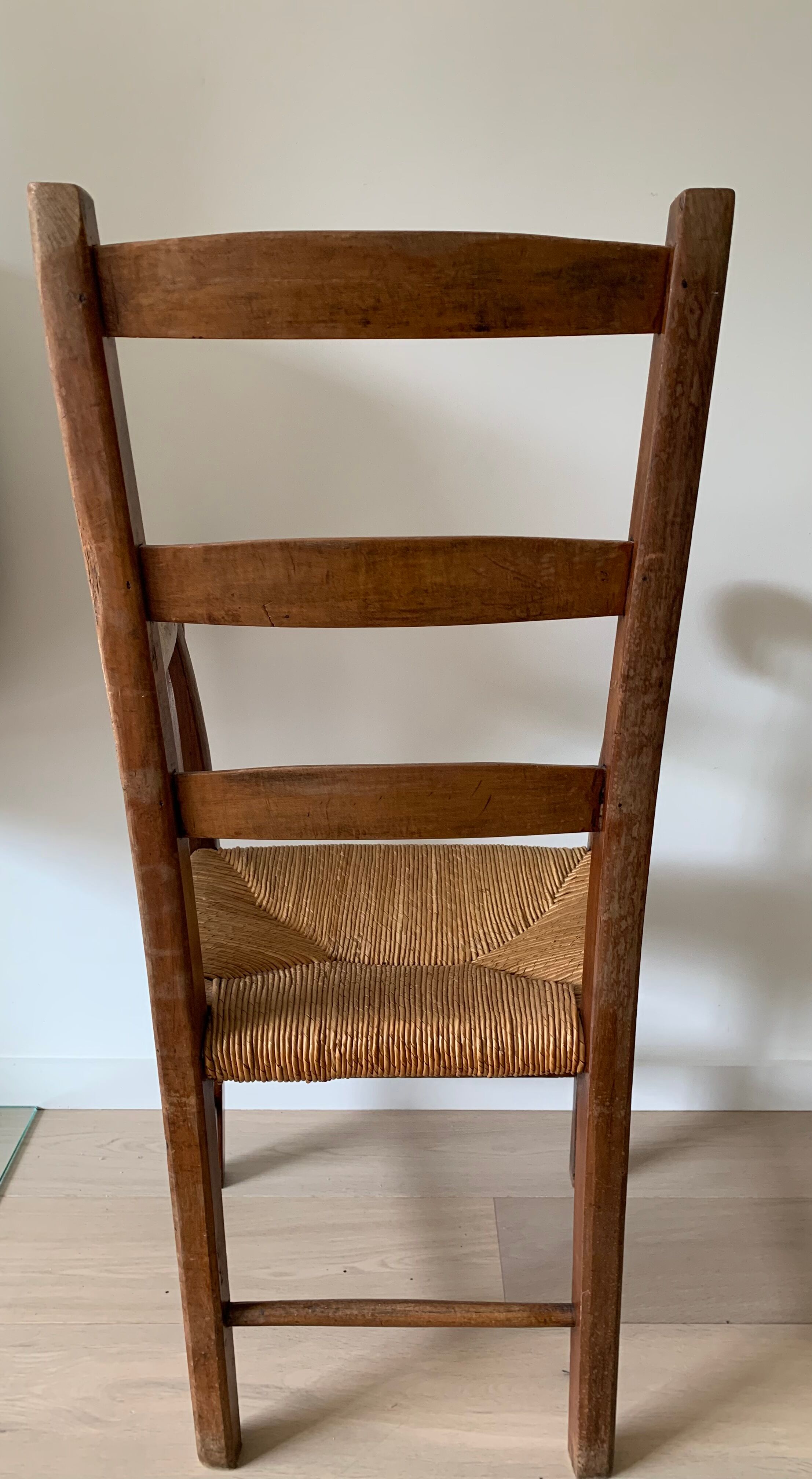 Antique wood and straw armchair