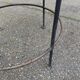 Round side table in woven straw and black steel