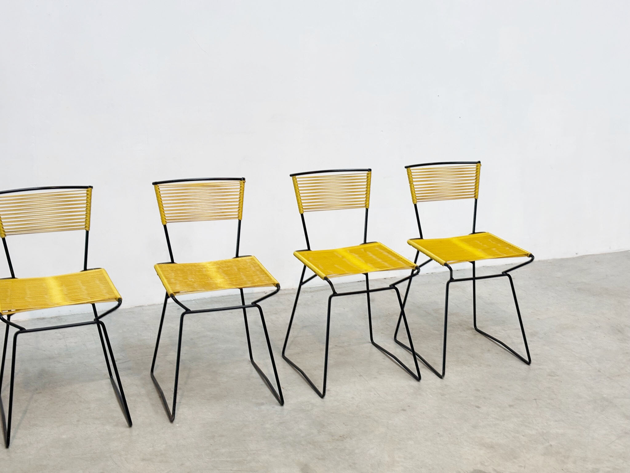 Set of six 'Spaghetti' dining chairs