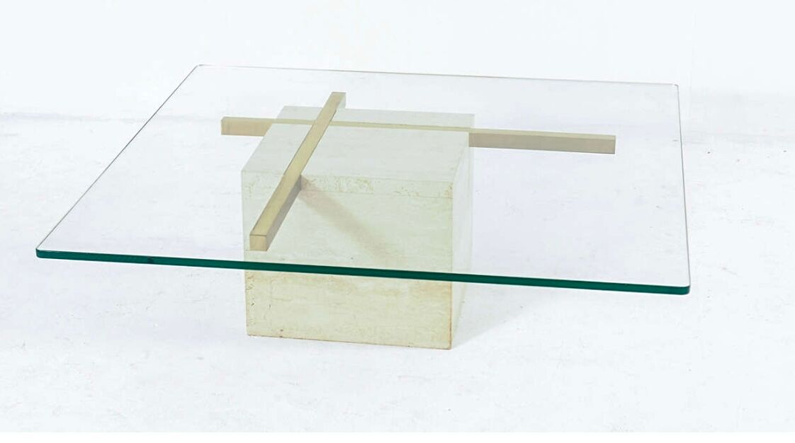 Coffee table with travertine gold-plated cross base and glass top