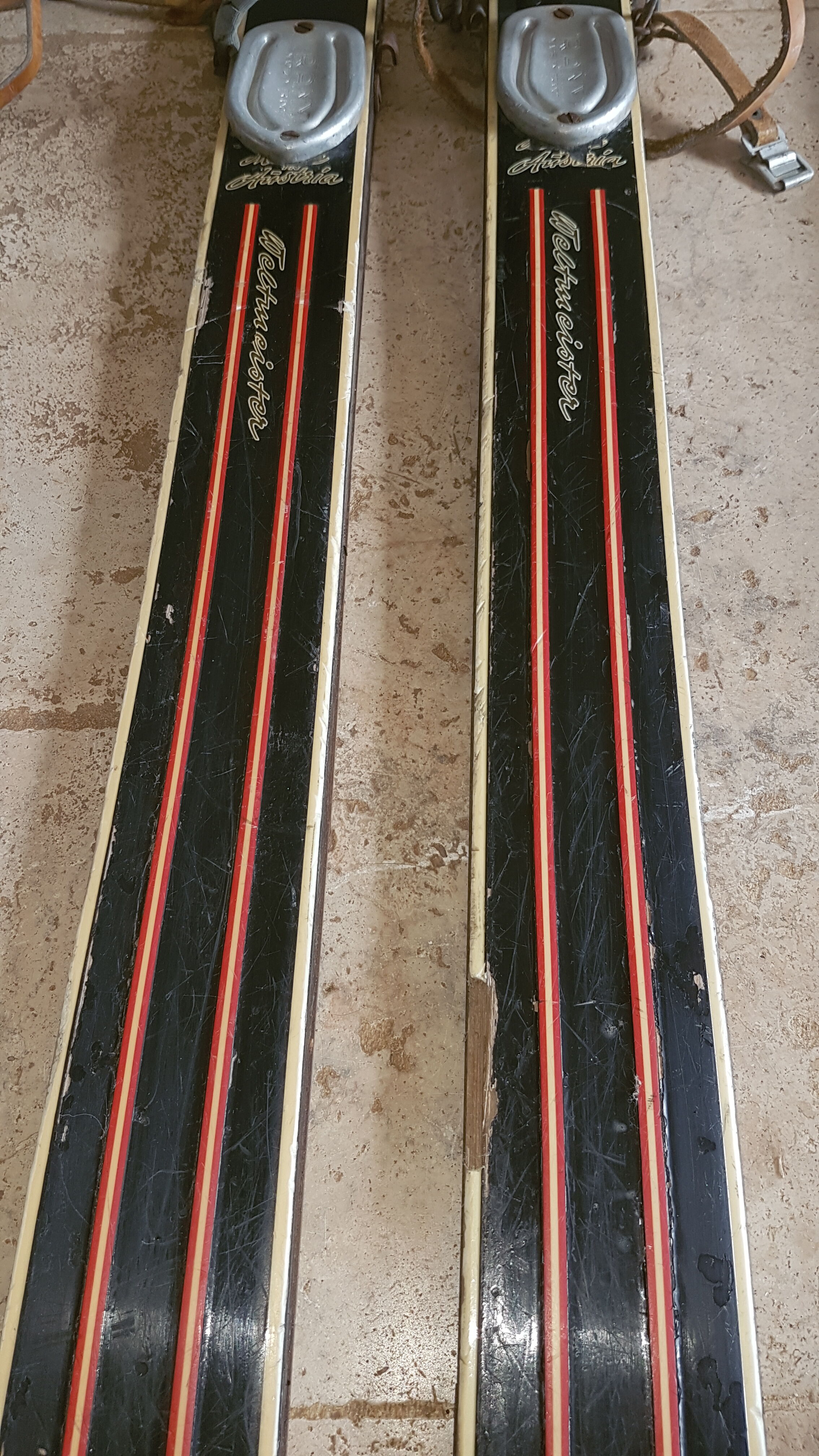 Old skis wooden and its pair of sticks