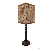 Turned wooden lamp with vintage herbarium lampshade