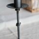 Antique tripod metal candlestick with knot decoration