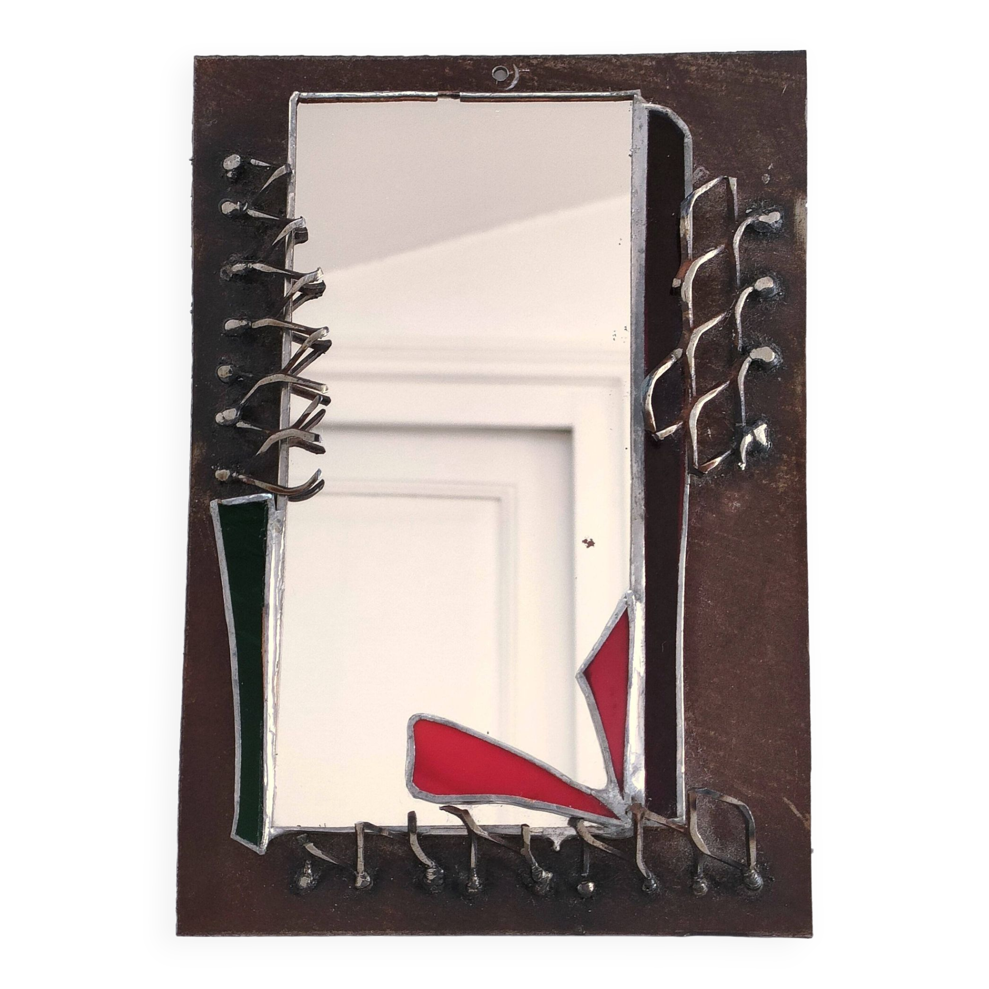 Brutalist mirror in metal and set glass