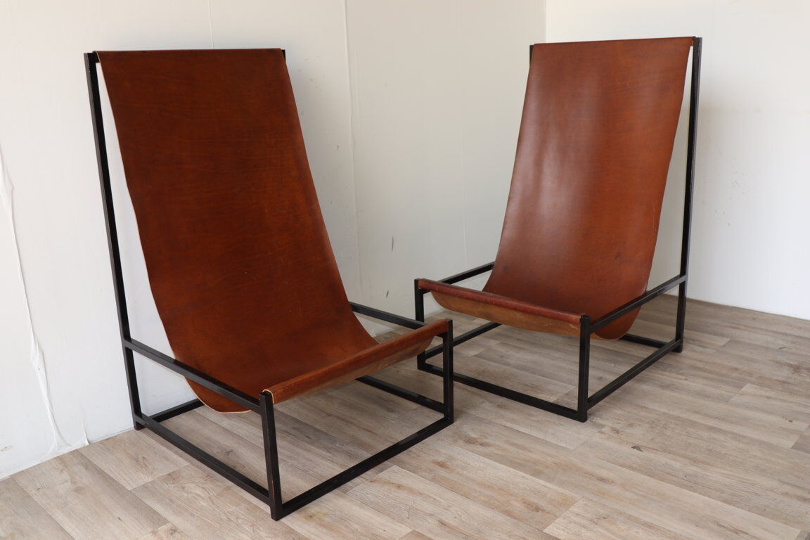 Pair of vintage armchairs in stretched leather and metal structure
