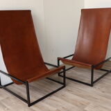Pair of vintage armchairs in stretched leather and metal structure