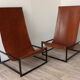 Pair of vintage armchairs in stretched leather and metal structure