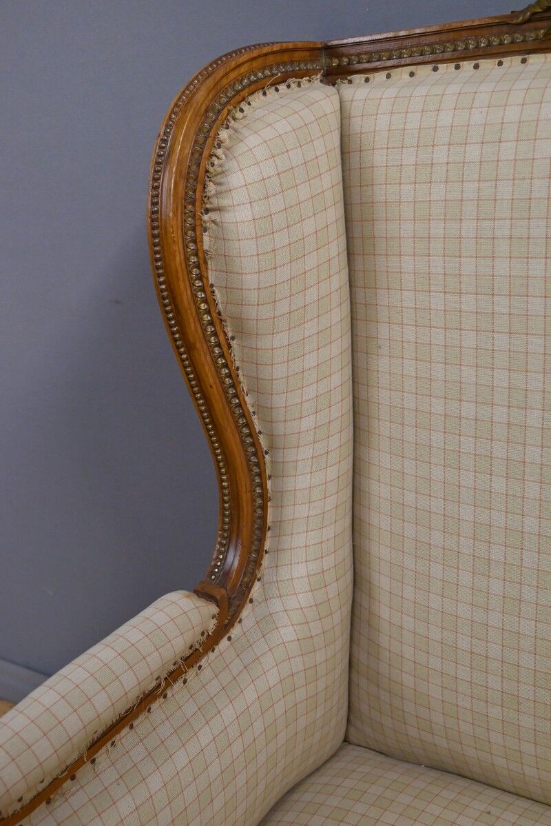 Wingback armchair in walnut, Louis XVI style – late 19th century