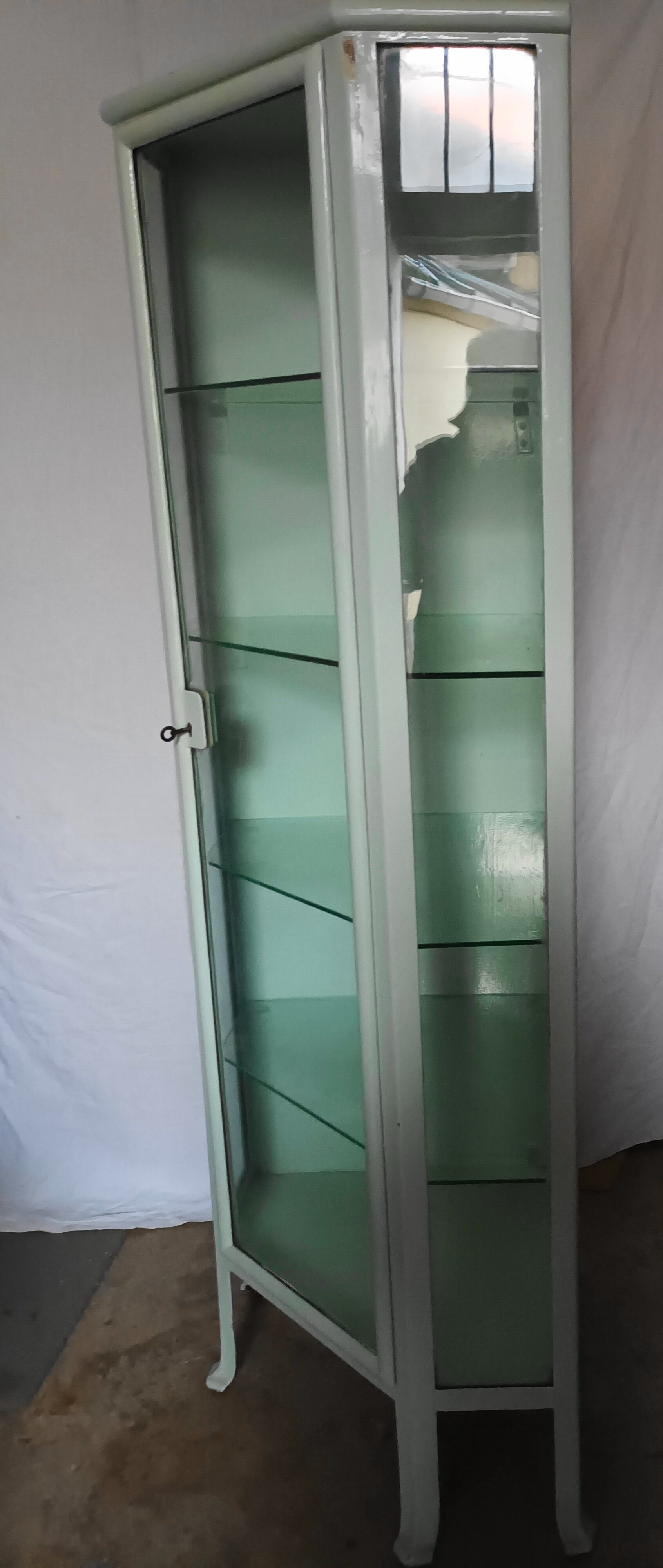 Painted metal ophthalmologist's corner display case, early 20th century