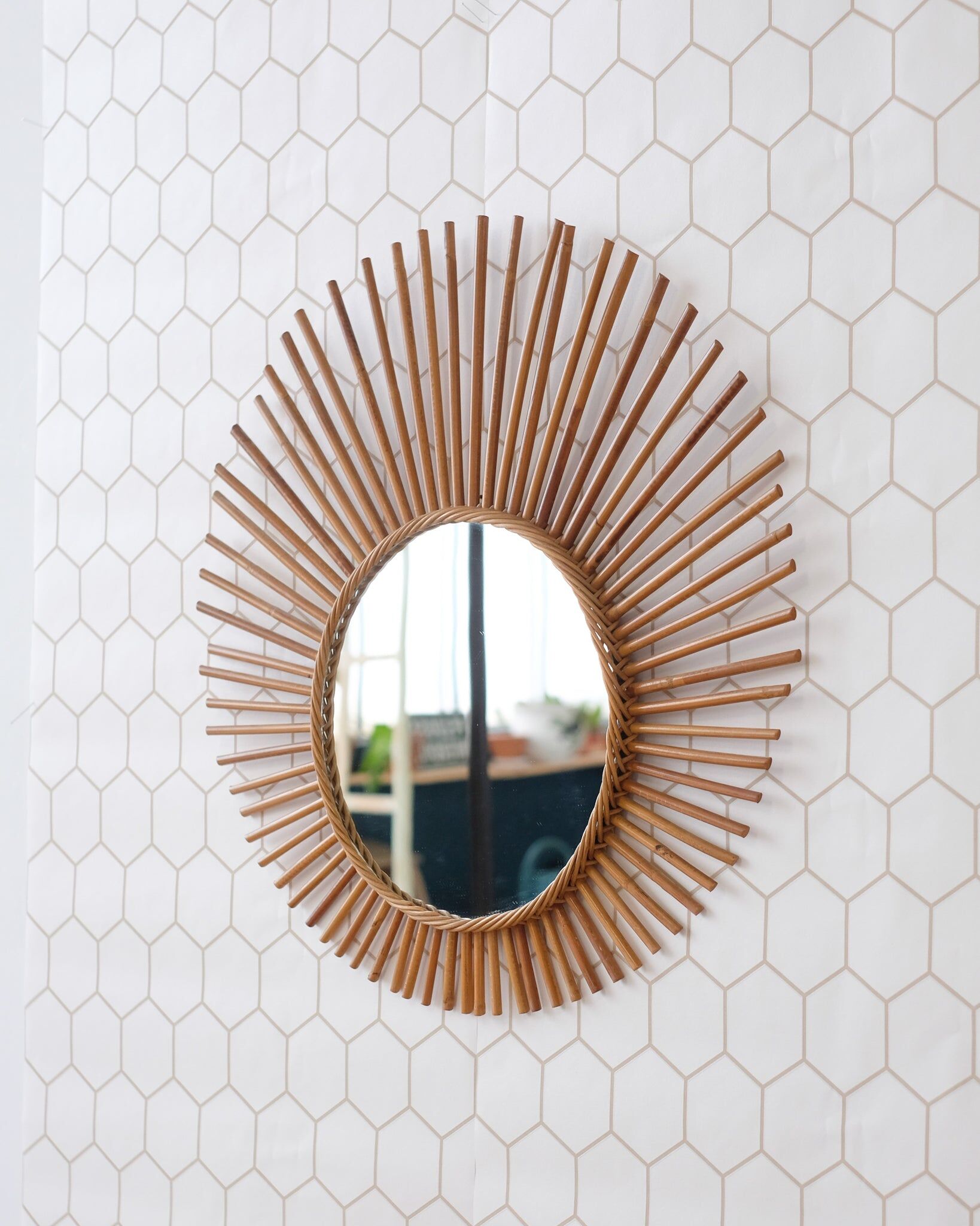 Old large rattan sun mirror