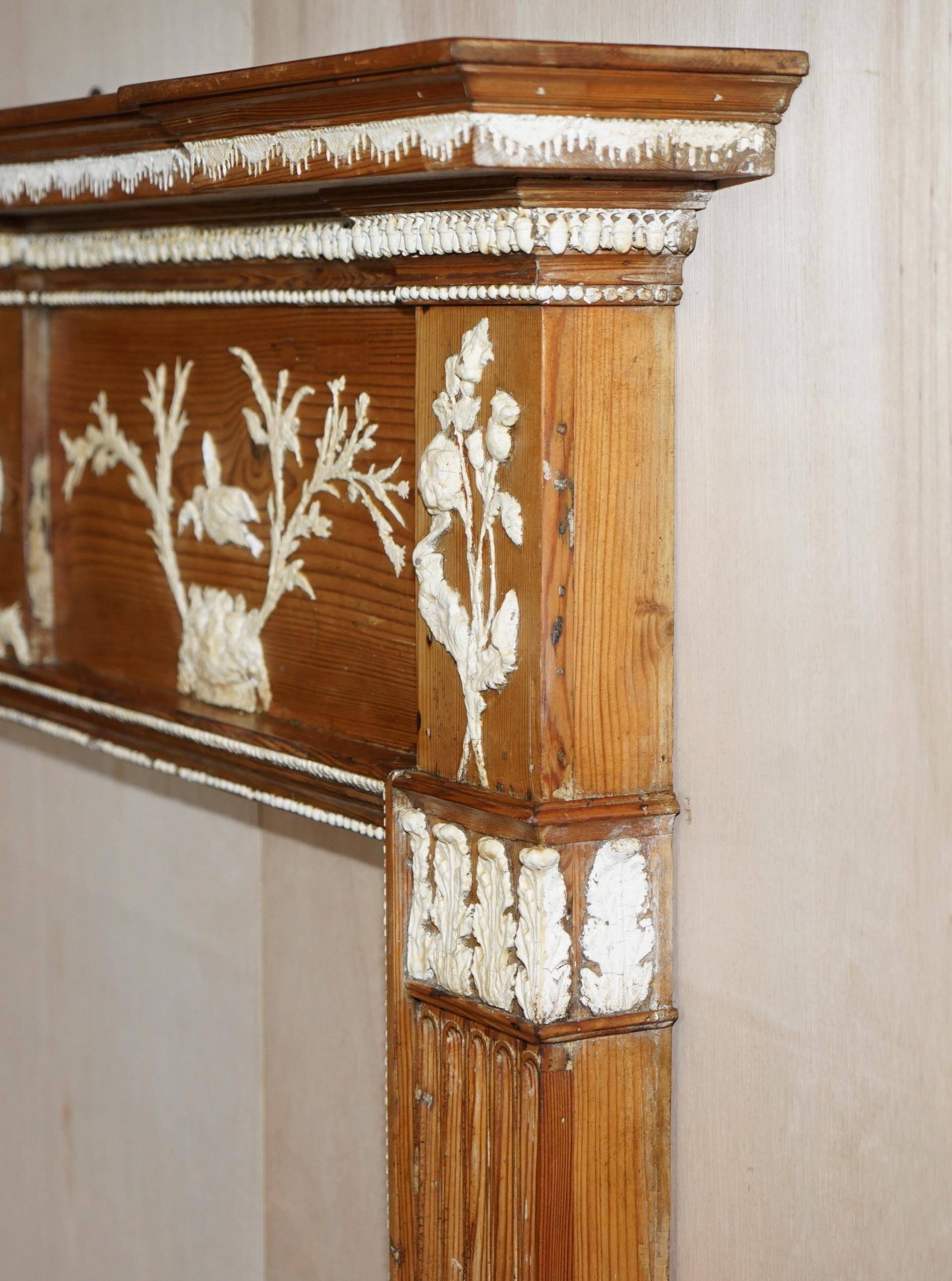 Victorian antique fireplace in tarred pine and sculpted gesso.