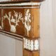 Victorian antique fireplace in tarred pine and sculpted gesso.
