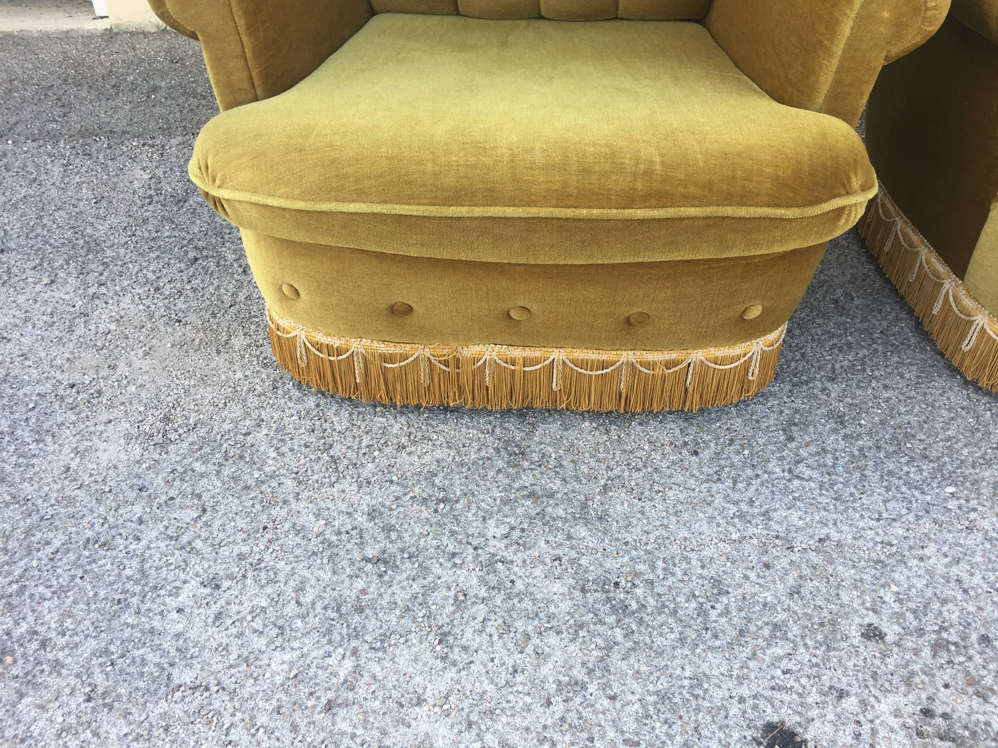 Pair of upholstered velvet armchairs