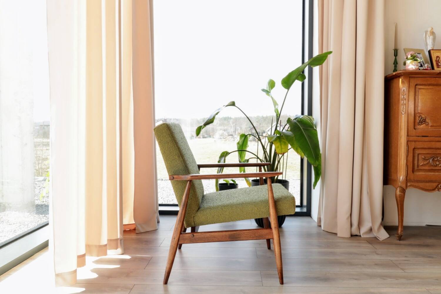 Mid-century modern armchair in olive green bouclé design by H. Lis.