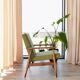 Mid-century modern armchair in olive green bouclé design by H. Lis.