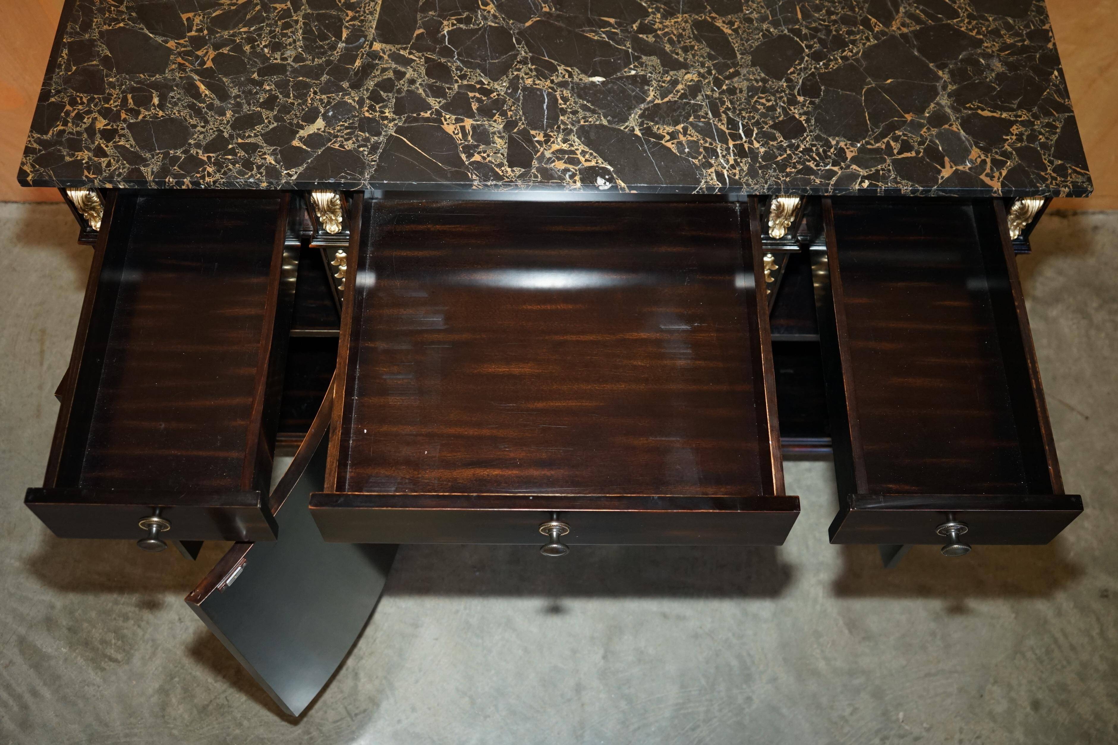 Contemporary Chinese buffet with a marble top and space for a mini-fridge.