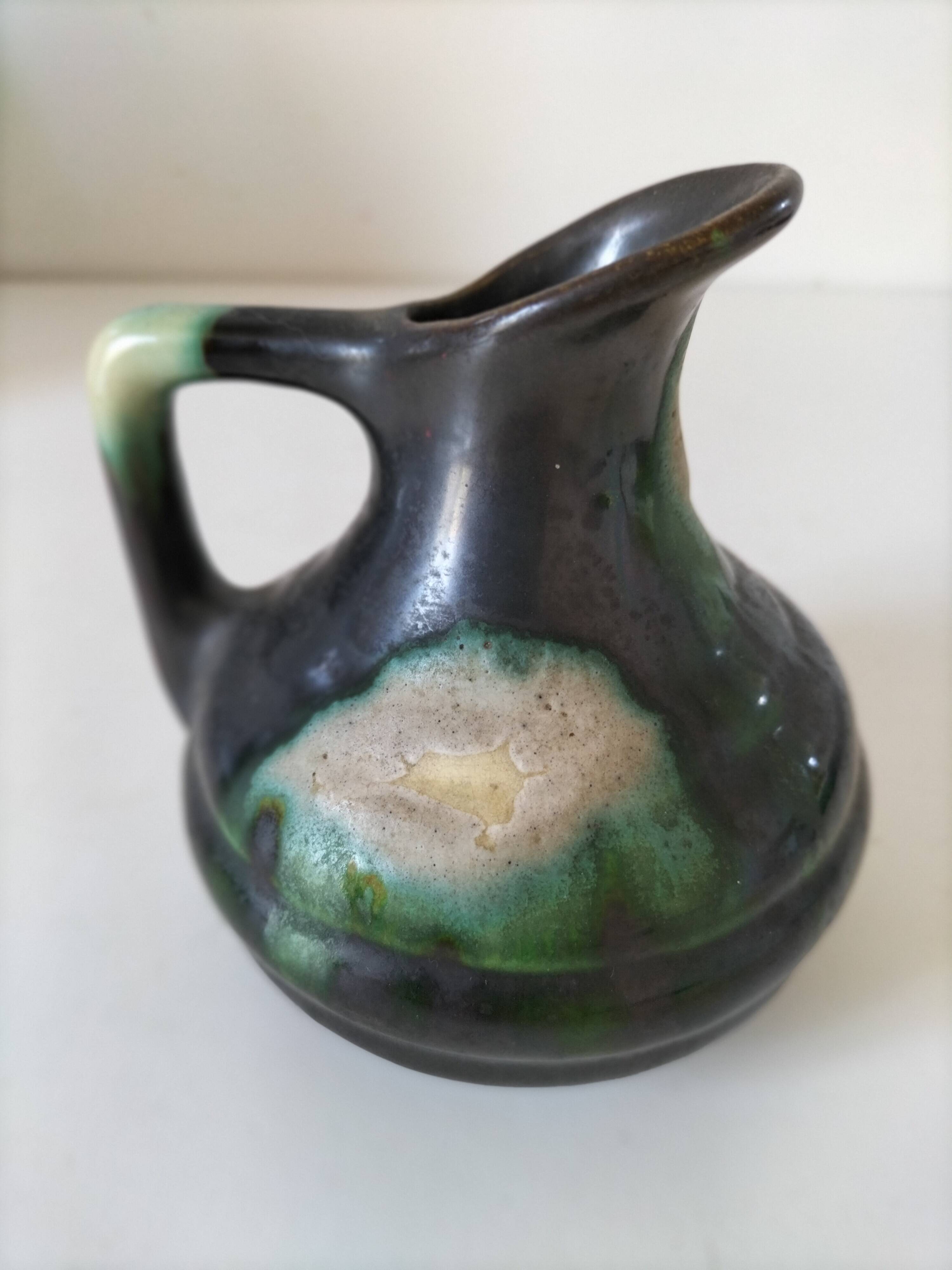 Ceramic pitcher Thulin Belgium flamed green black enamel
