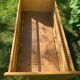 Vintage wooden and rattan baby cot from the 1960s.
