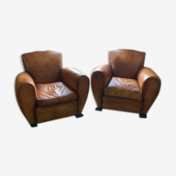 Pair of club chairs gold leather mustache