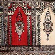 Tapis vintage fait main Bukhara de prière en laine rouge (45cm x 101cm)