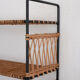 Woven rattan shelf and black metal