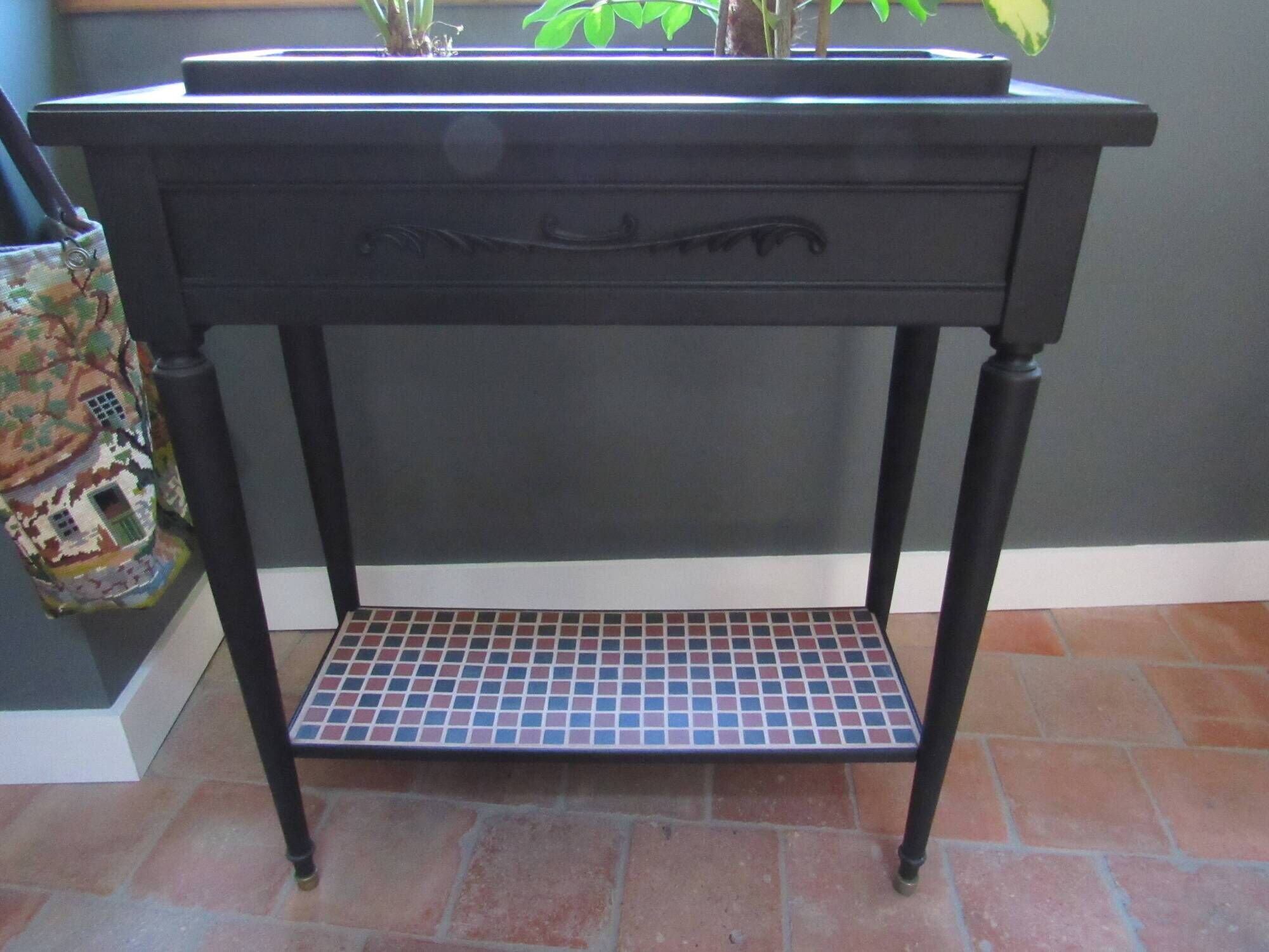 Vintage planter on wheels made of oak, repainted in black.