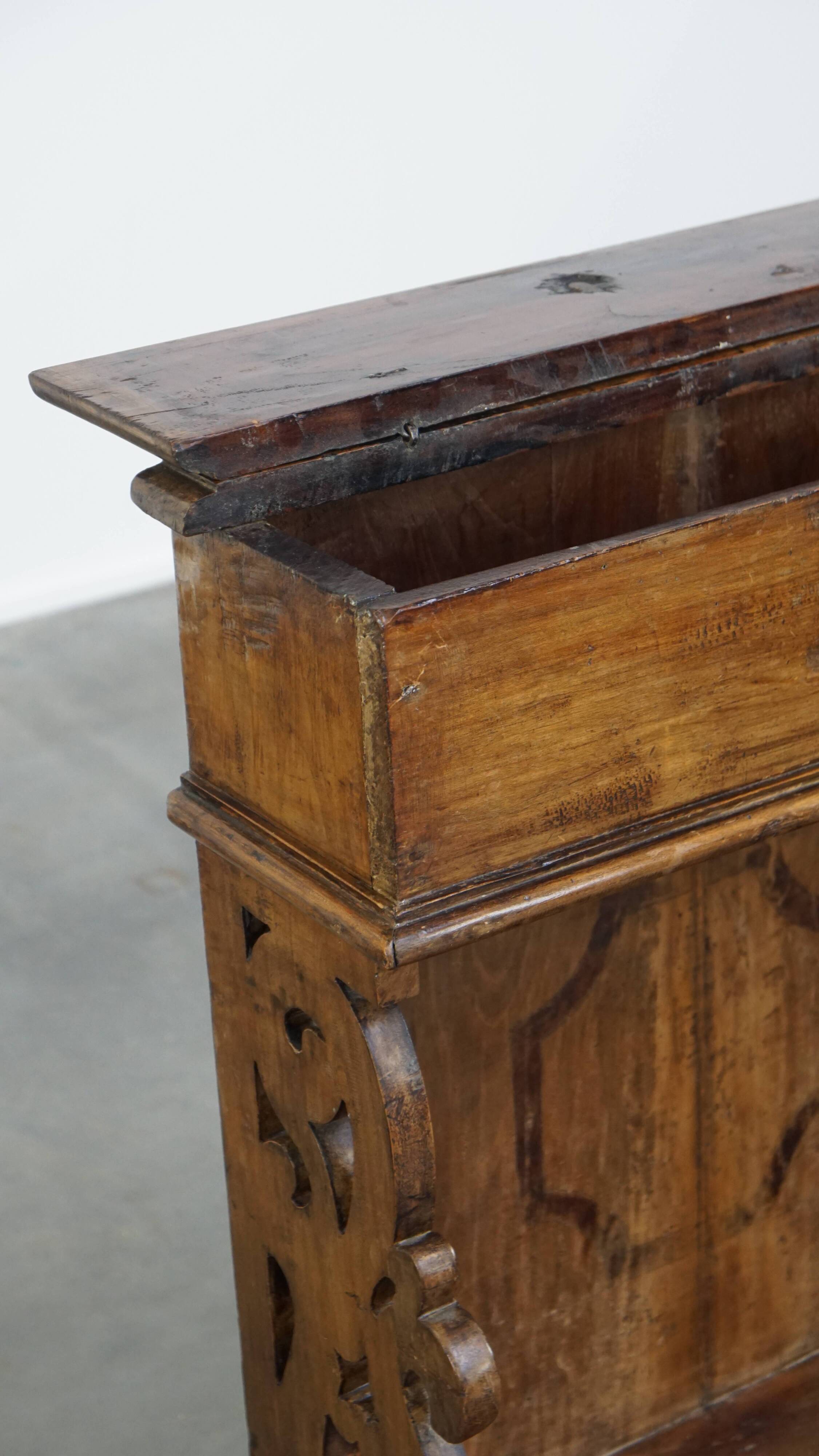 Antique pinewood church pew with storage compartments from the 18th century